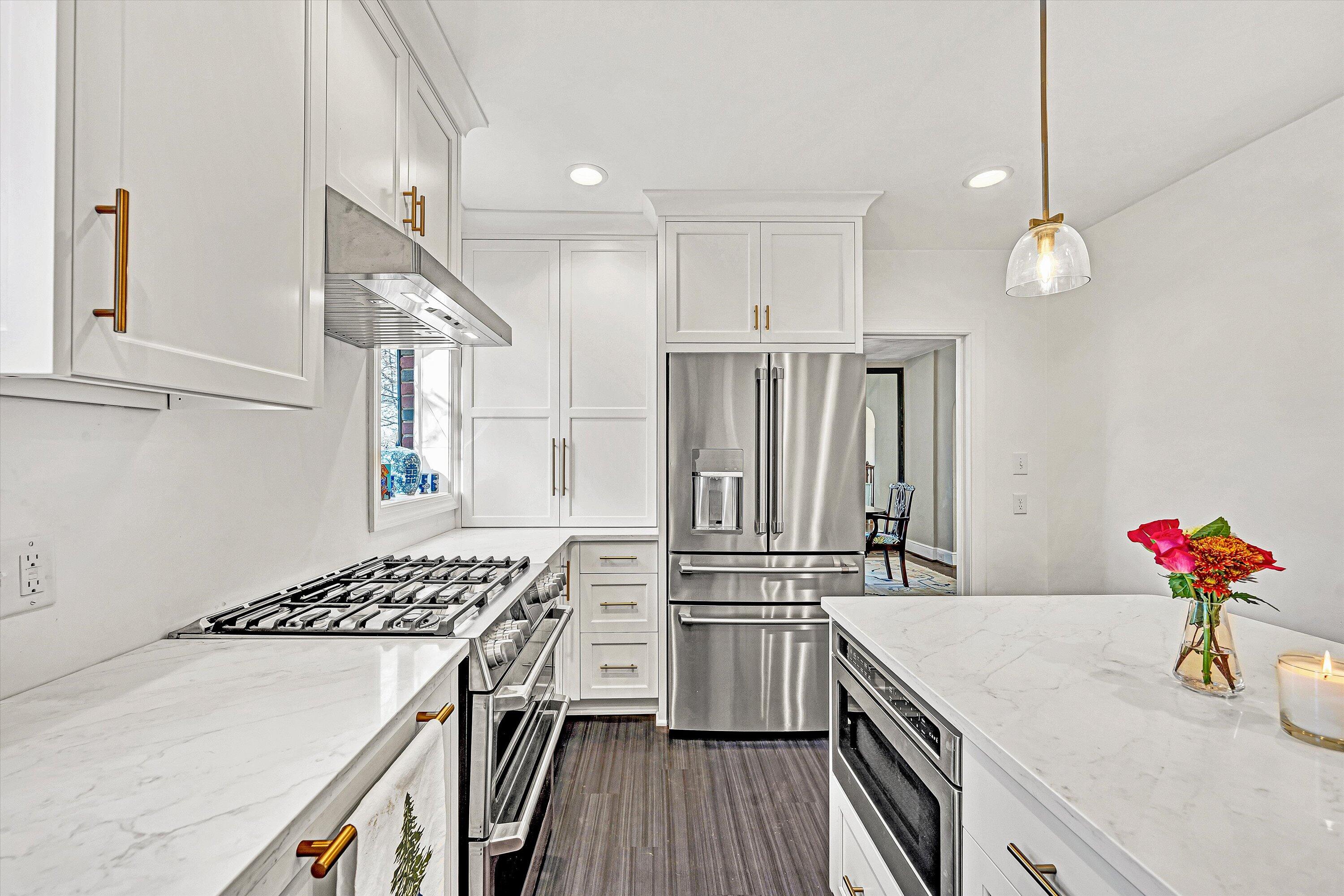3232 Allendale Street Southwest Roanoke, VA 24014 - Photo 18 of 48 a kitchen that has a kitchen island wooden floor and stainless steel appliances