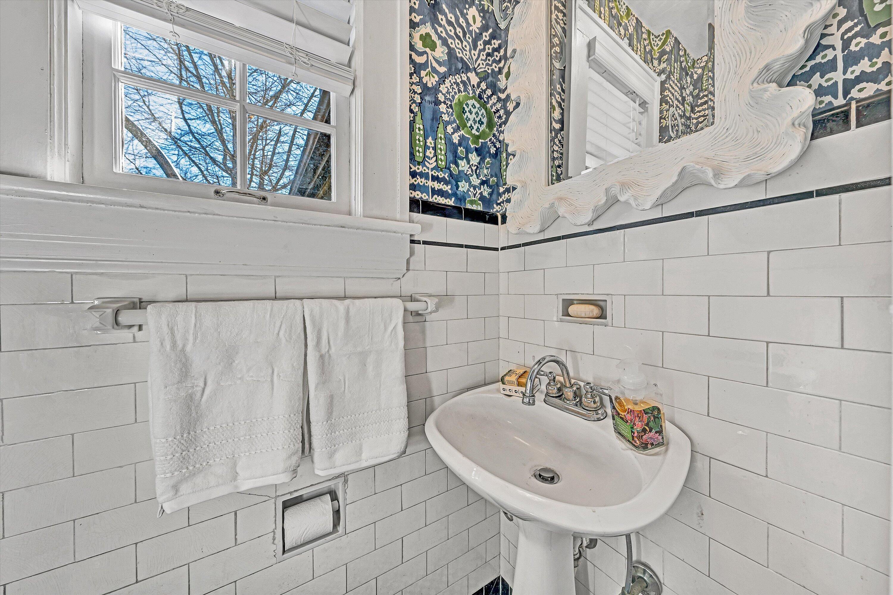 3232 Allendale Street Southwest Roanoke, VA 24014 - Photo 21 of 48 a bathroom with a sink and a mirror