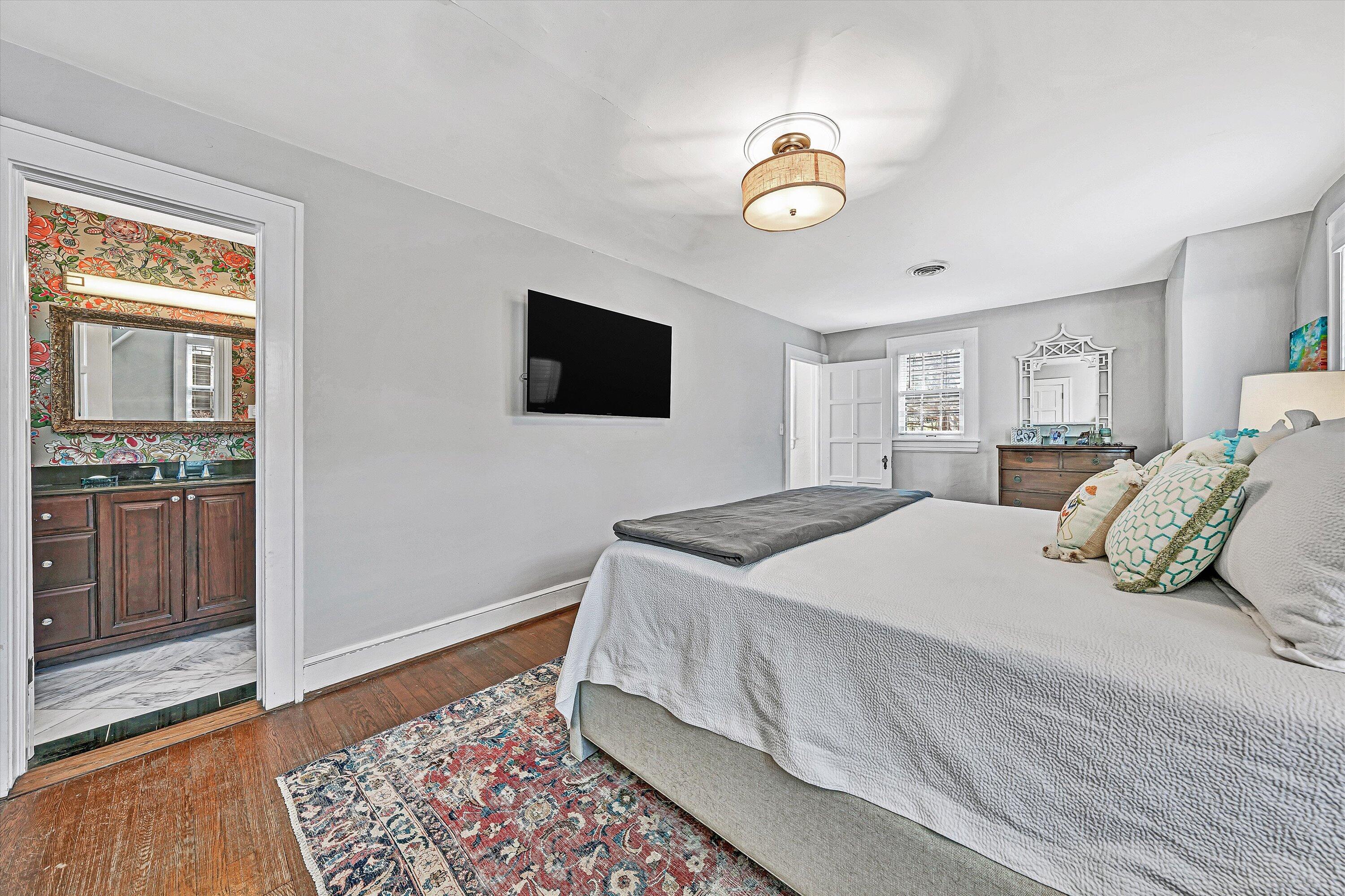 3232 Allendale Street Southwest Roanoke, VA 24014 - Photo 28 of 48 a bedroom with a large bed and a flat screen tv