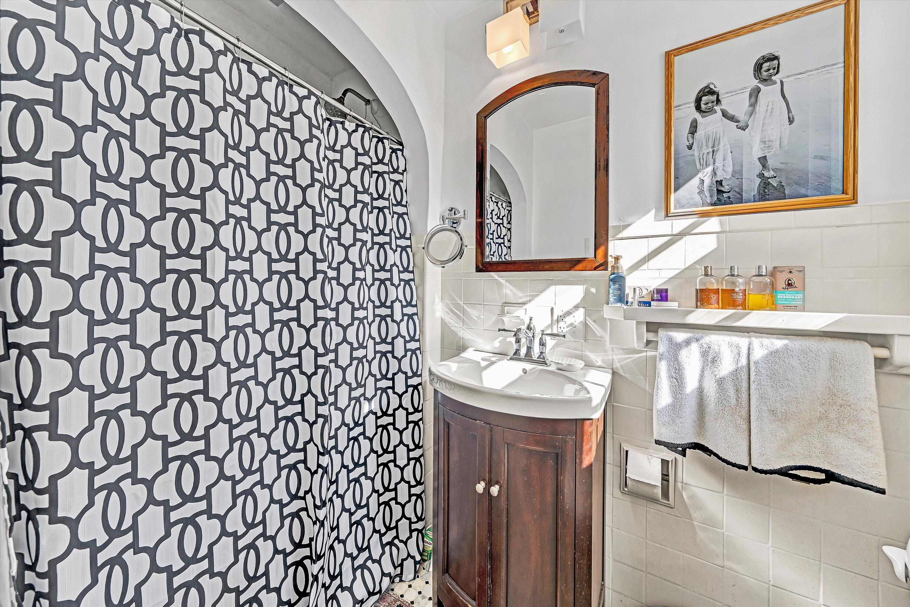 3232 Allendale Street Southwest Roanoke, VA 24014 - Photo 30 of 48 a bathroom with a sink and a mirror