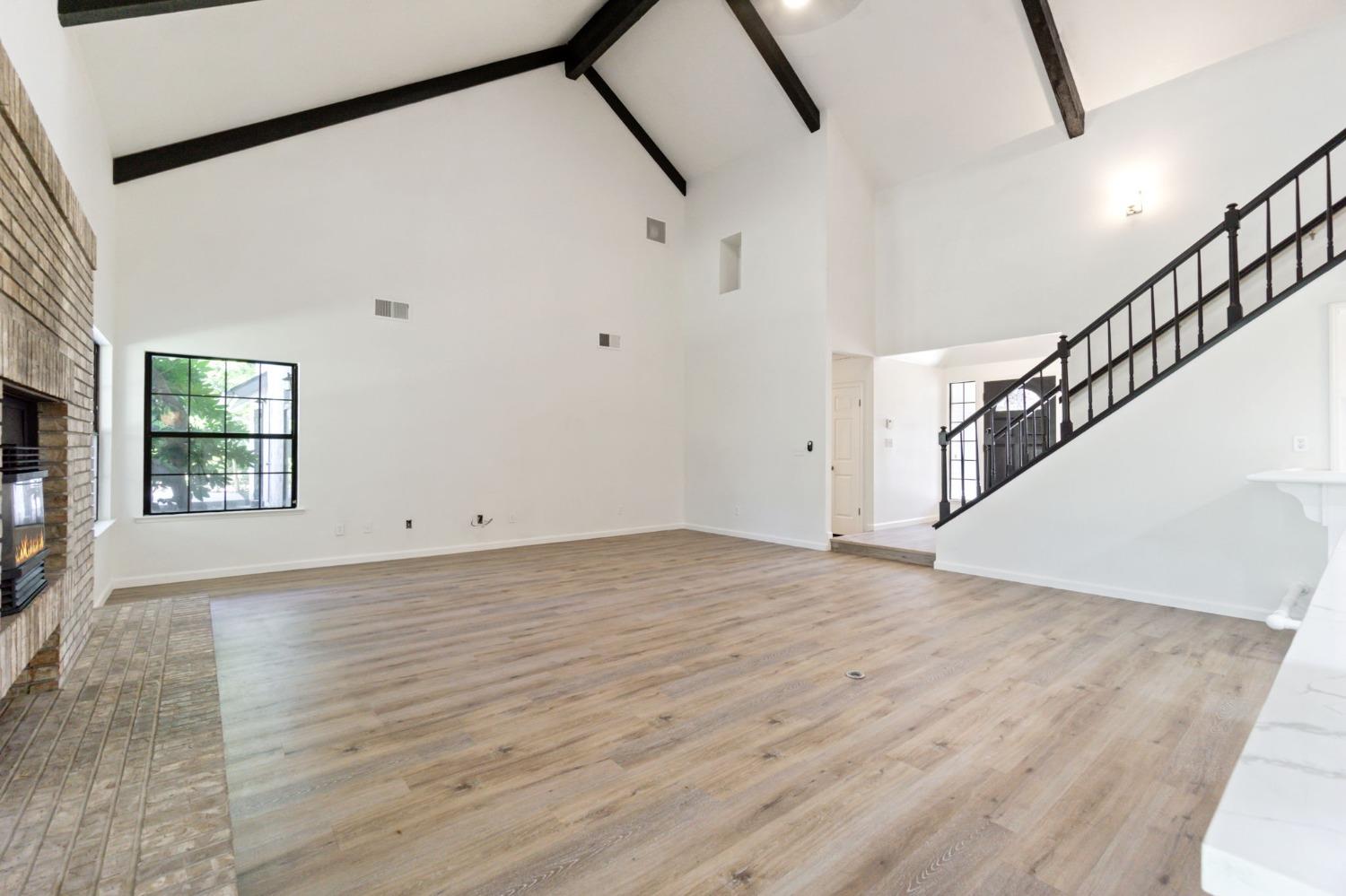 1965 Swift Avenue Clovis, CA 93611 - Photo 10 of 43 a view of a room with wooden floor and staircase