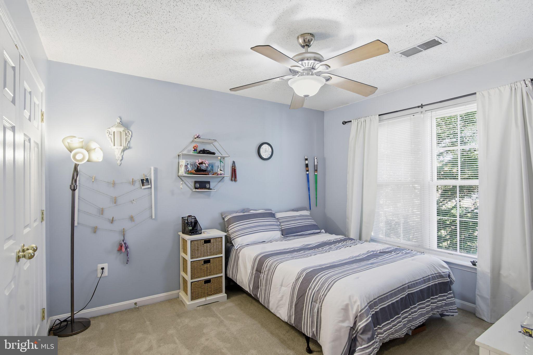 3 Rixey Court Fredericksburg, VA 22405 - Photo 15 of 31 a bedroom with a bed and a chandelier