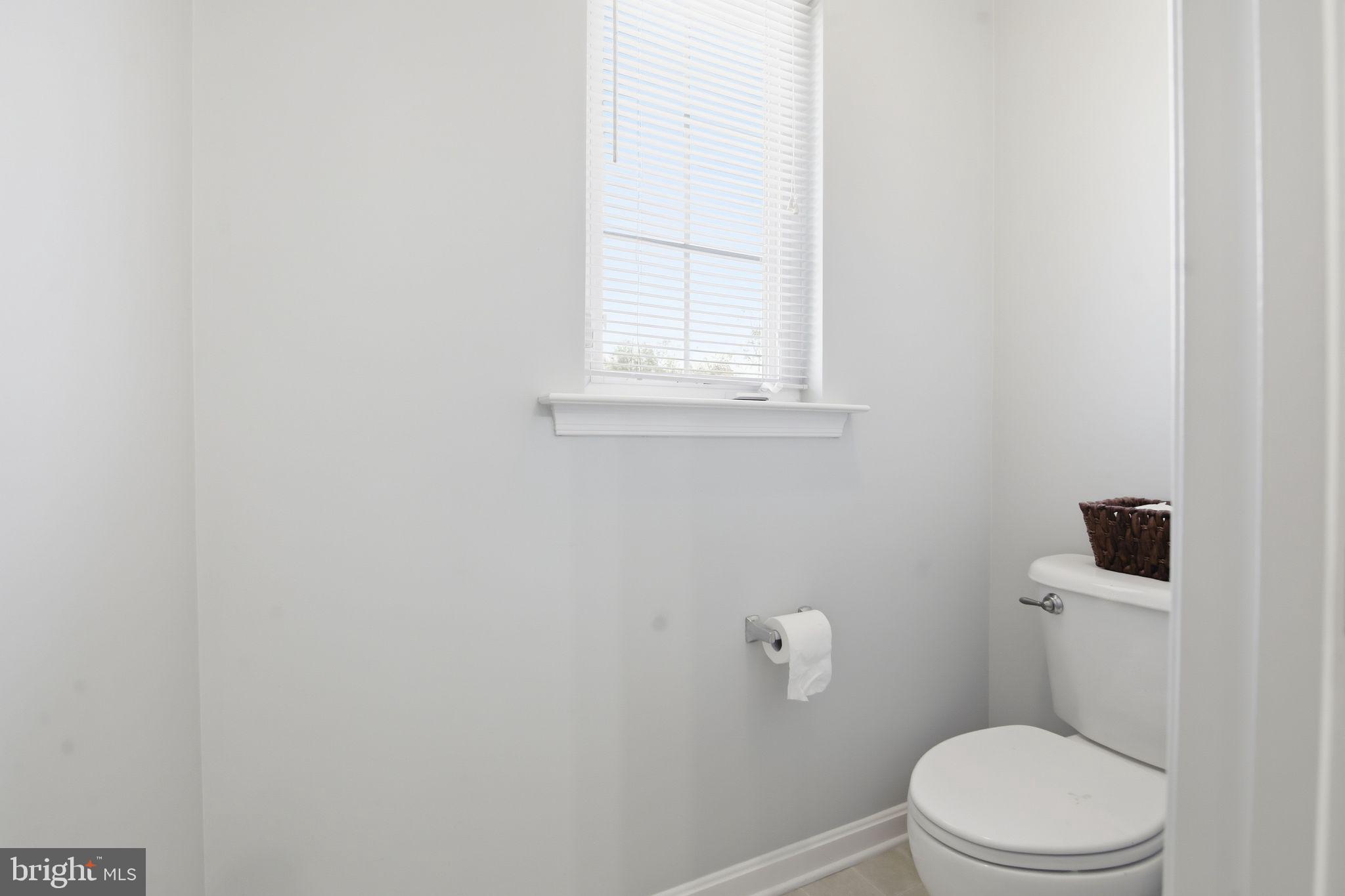 3 Rixey Court Fredericksburg, VA 22405 - Photo 21 of 31 a white toilet sitting next to a window