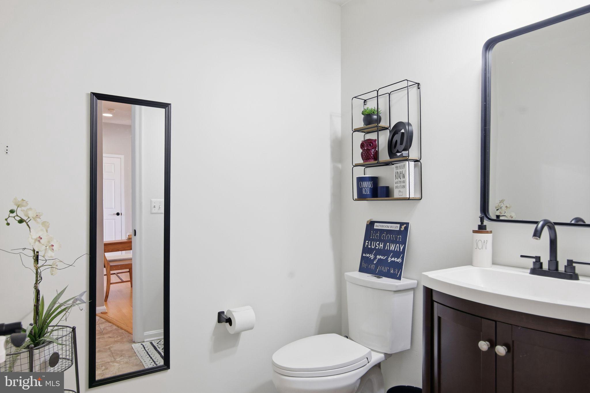 3 Rixey Court Fredericksburg, VA 22405 - Photo 23 of 31 a bathroom with a toilet a sink and mirror