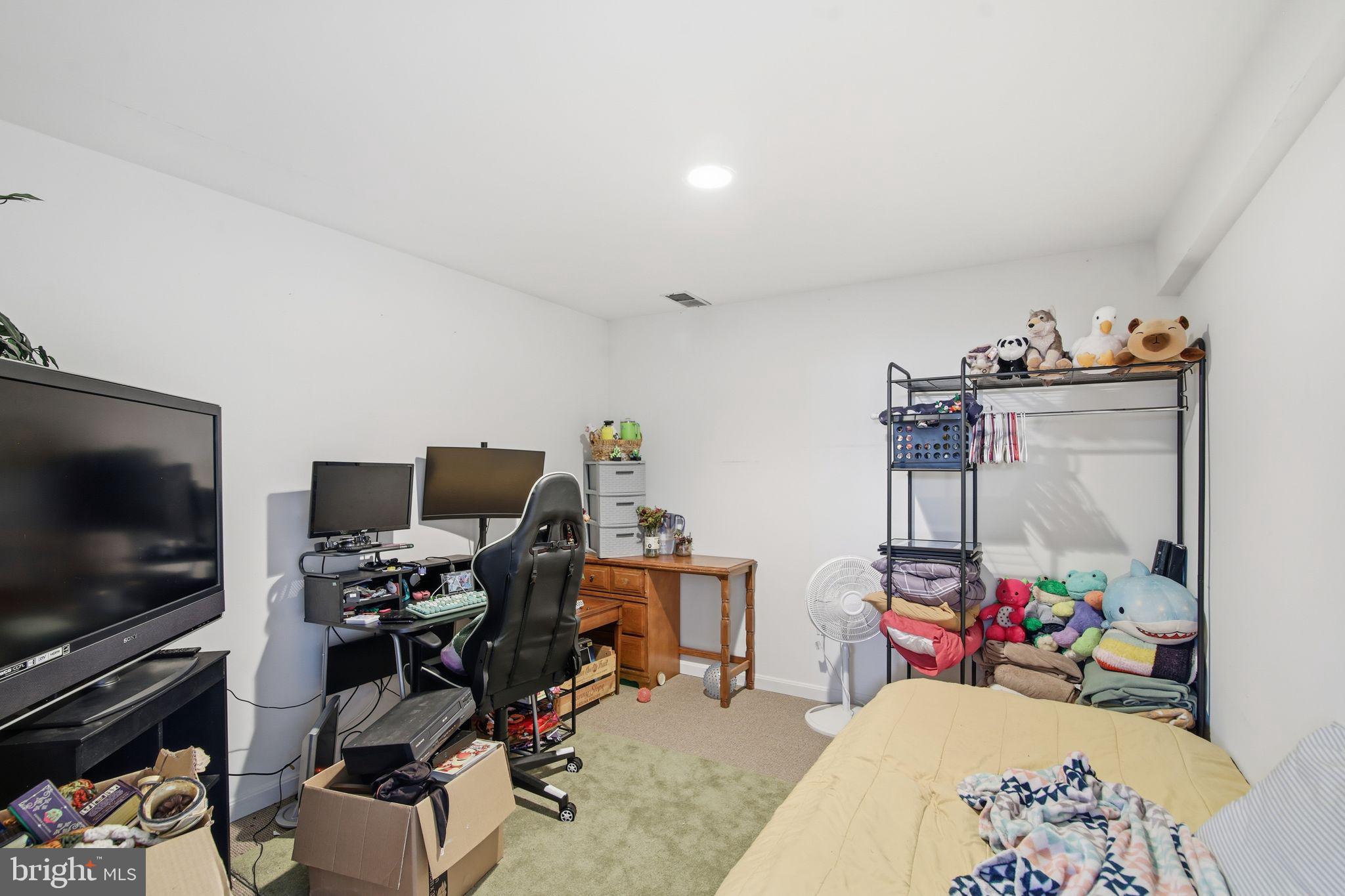 3 Rixey Court Fredericksburg, VA 22405 - Photo 24 of 31 a bedroom with furniture and a flat screen tv