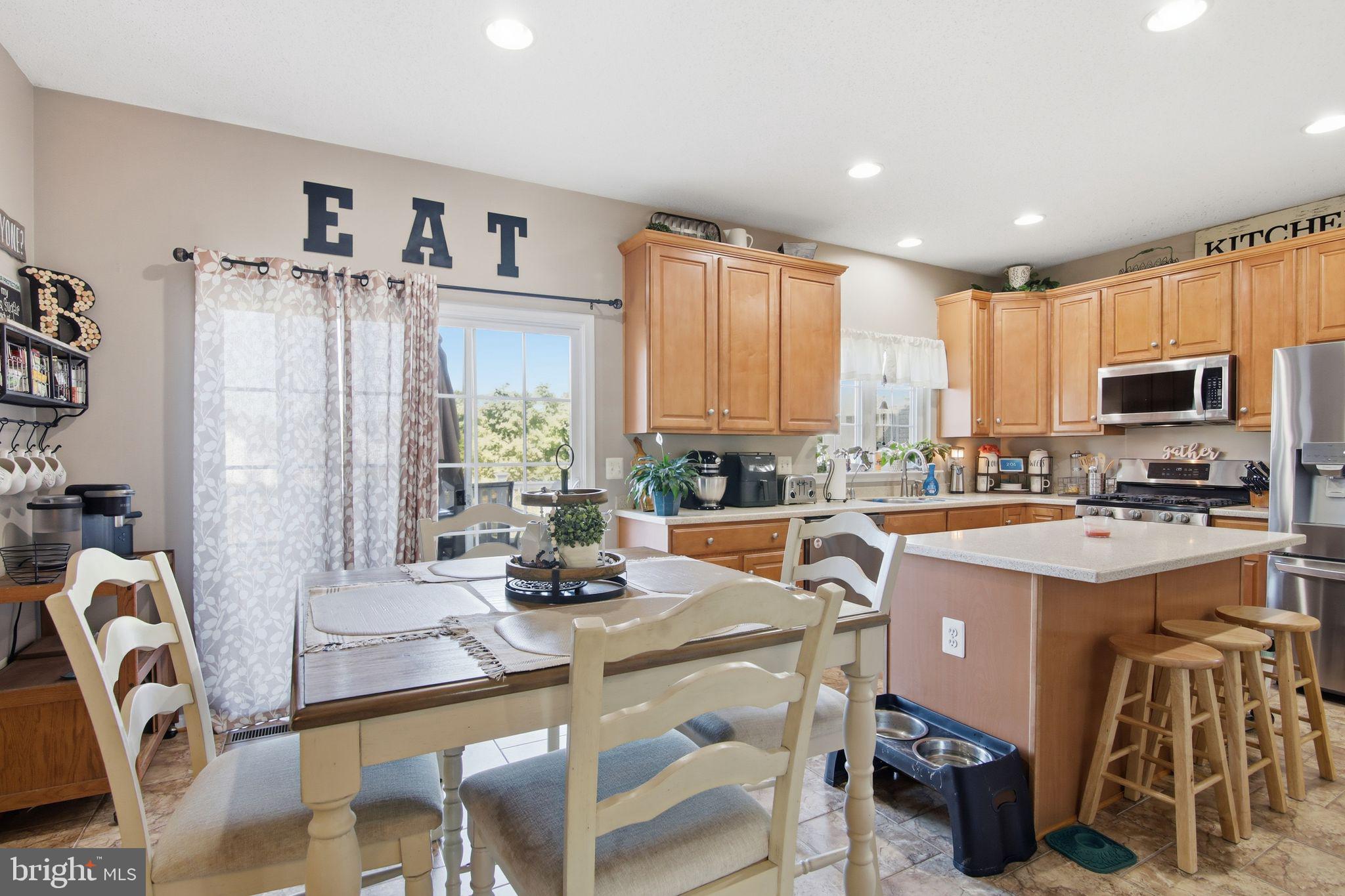 3 Rixey Court Fredericksburg, VA 22405 - Photo 6 of 31 a kitchen with a sink a counter top space appliances and cabinets