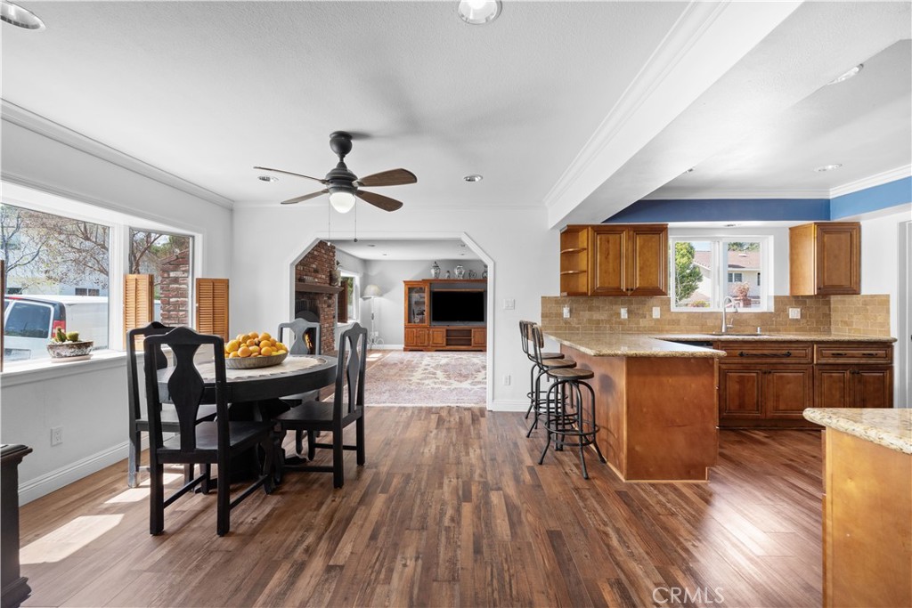 24405 Derian Drive Newhall, CA 91321 - Photo 16 of 36 a view of a dining room with furniture window and wooden floor
