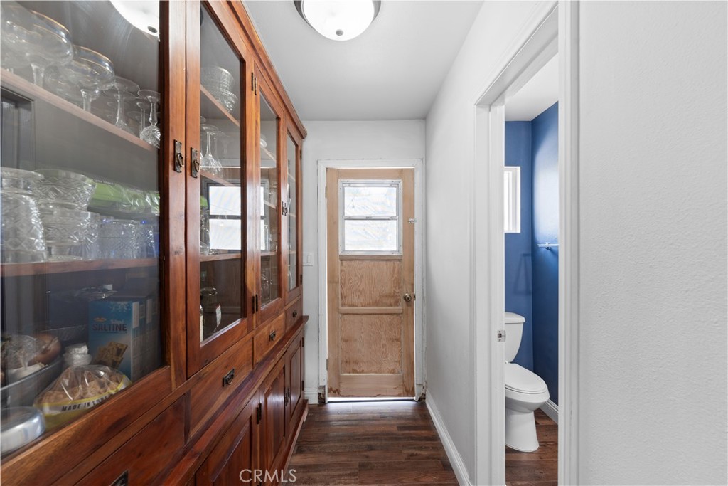 24405 Derian Drive Newhall, CA 91321 - Photo 17 of 36 a view of a hallway with wooden floor and windows