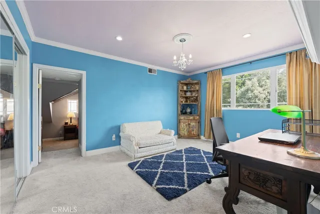 a living room with furniture a large window and table