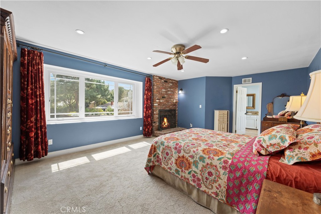 24405 Derian Drive Newhall, CA 91321 - Photo 25 of 36 a bedroom with a large bed and a window