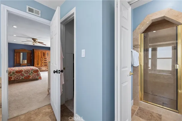 a view of a bedroom from a hallway