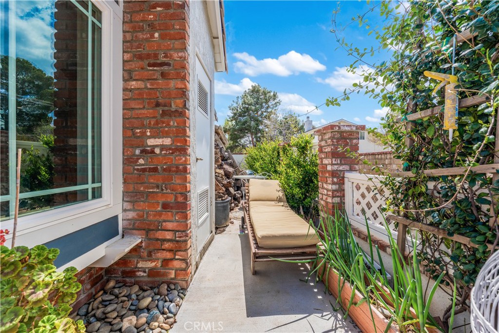 24405 Derian Drive Newhall, CA 91321 - Photo 33 of 36 a view of a balcony with chairs and potted plants