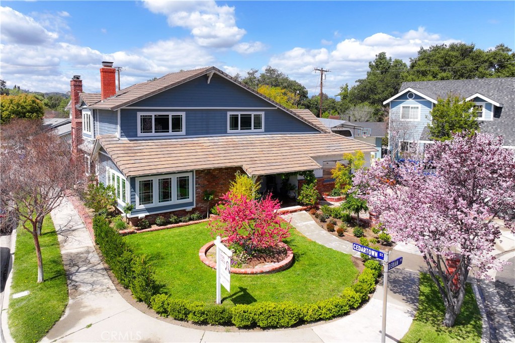 24405 Derian Drive Newhall, CA 91321 - Photo 35 of 36 a view of a house with a porch and garden