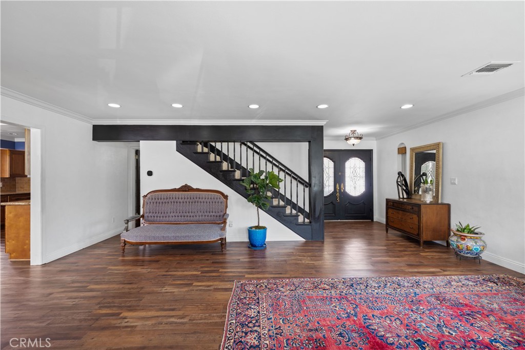 24405 Derian Drive Newhall, CA 91321 - Photo 6 of 36 a view of entryway and hall with wooden floor