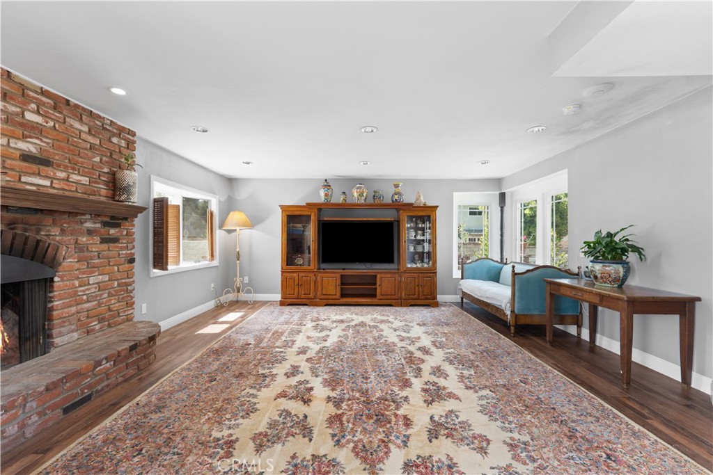 24405 Derian Drive Newhall, CA 91321 - Photo 8 of 36 a living room with furniture and a fireplace