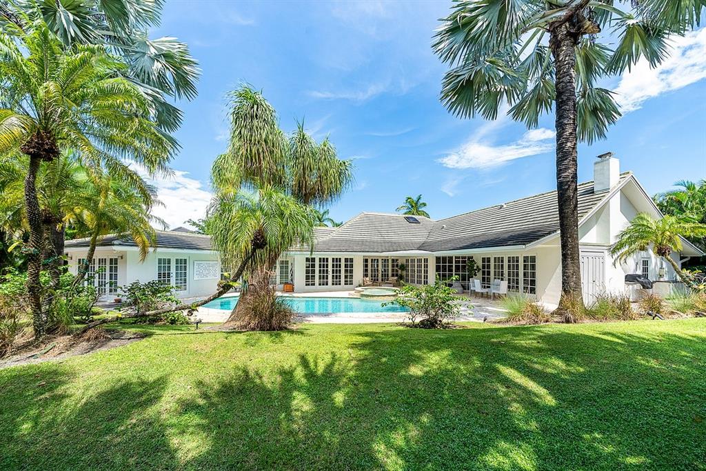 17844 Scarsdale Way Boca Raton, FL 33496 - Photo 25 of 38 a front view of a house with garden and trees