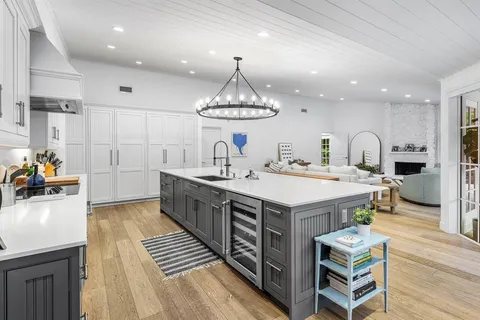 a kitchen with a sink and a stove