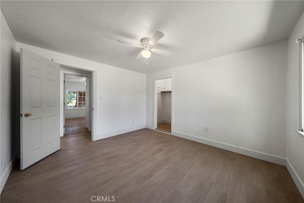 1980 Big Valley Road Lakeport, CA 95453 - Photo 10 of 56 a view of an empty room with closet and a chandelier fan