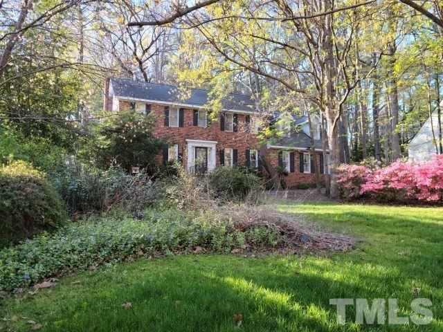 7817 Hardwick Drive Raleigh, NC 27615 - Photo 4 of 23 a front view of a house with garden