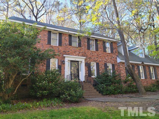 7817 Hardwick Drive Raleigh, NC 27615 - Photo 5 of 23 a front view of a house with garden