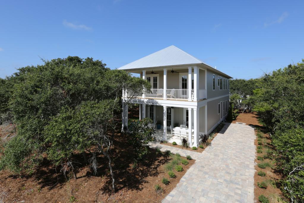 10 Sea Grade Road Santa Rosa Beach, FL 32459 - Photo 1 of 51 a front view of a house with a yard