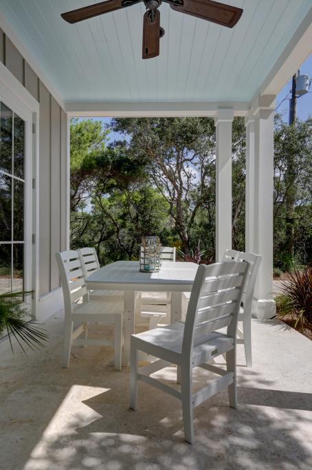 10 Sea Grade Road Santa Rosa Beach, FL 32459 - Photo 12 of 51 a view of a patio with a table chairs and a backyard