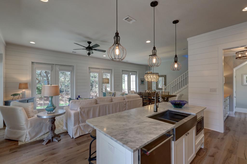 10 Sea Grade Road Santa Rosa Beach, FL 32459 - Photo 14 of 51 a kitchen with a stove a counter space dining table and chairs