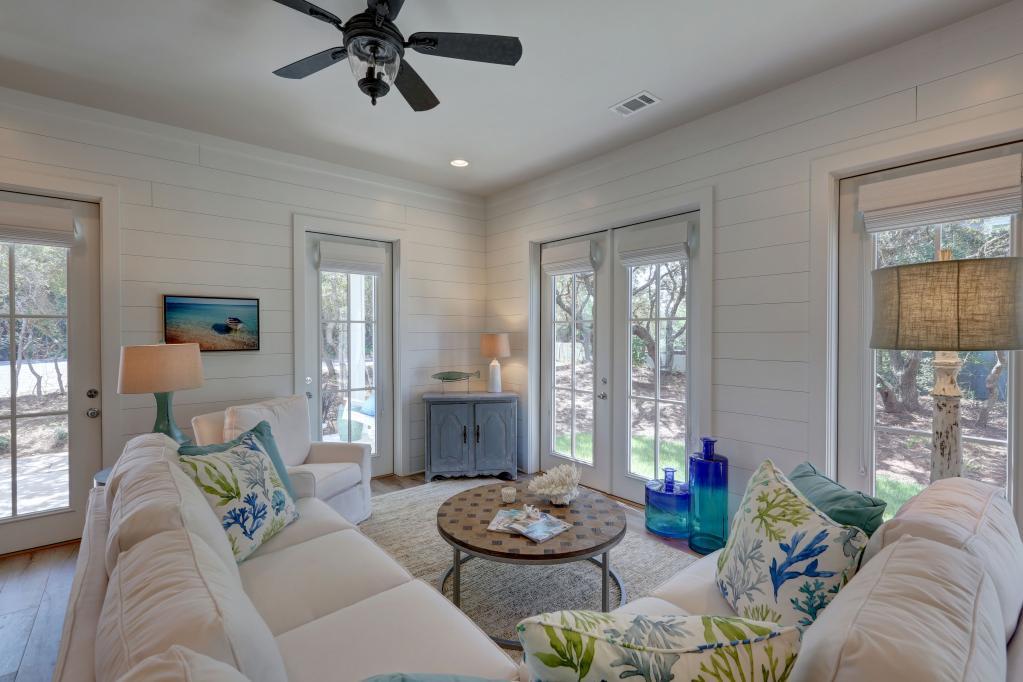 10 Sea Grade Road Santa Rosa Beach, FL 32459 - Photo 17 of 51 a living room with furniture and a large window