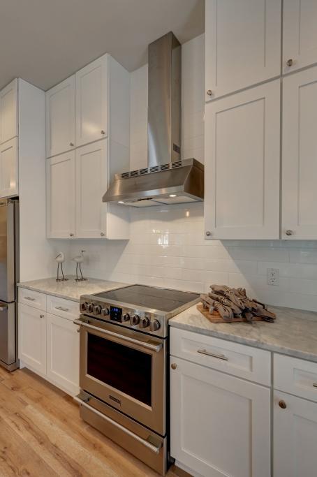 10 Sea Grade Road Santa Rosa Beach, FL 32459 - Photo 20 of 51 a kitchen with granite countertop white cabinets and stainless steel appliances