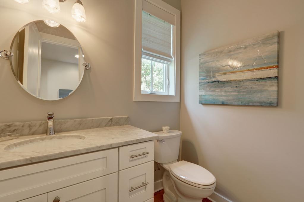 10 Sea Grade Road Santa Rosa Beach, FL 32459 - Photo 25 of 51 a bathroom with a toilet a sink and mirror