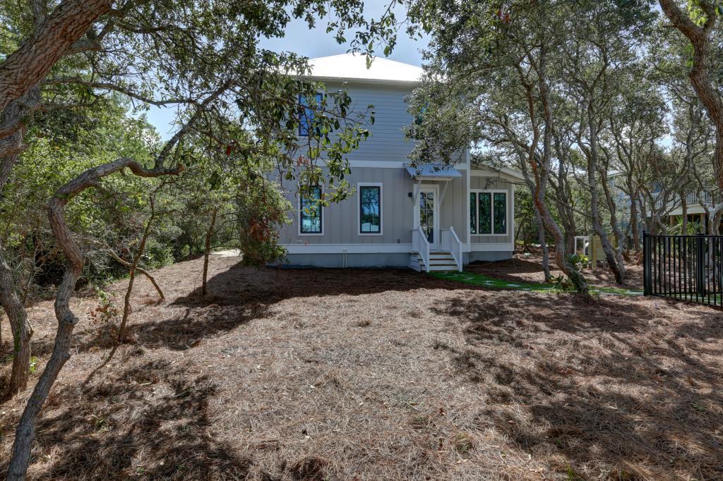 10 Sea Grade Road Santa Rosa Beach, FL 32459 - Photo 4 of 51 a view of a house with a yard and large tree
