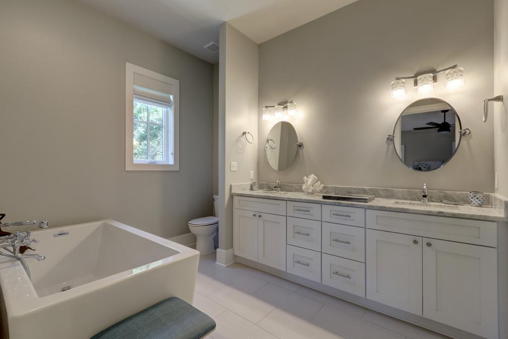 10 Sea Grade Road Santa Rosa Beach, FL 32459 - Photo 31 of 51 a bathroom with a granite countertop sink a mirror and bathtub