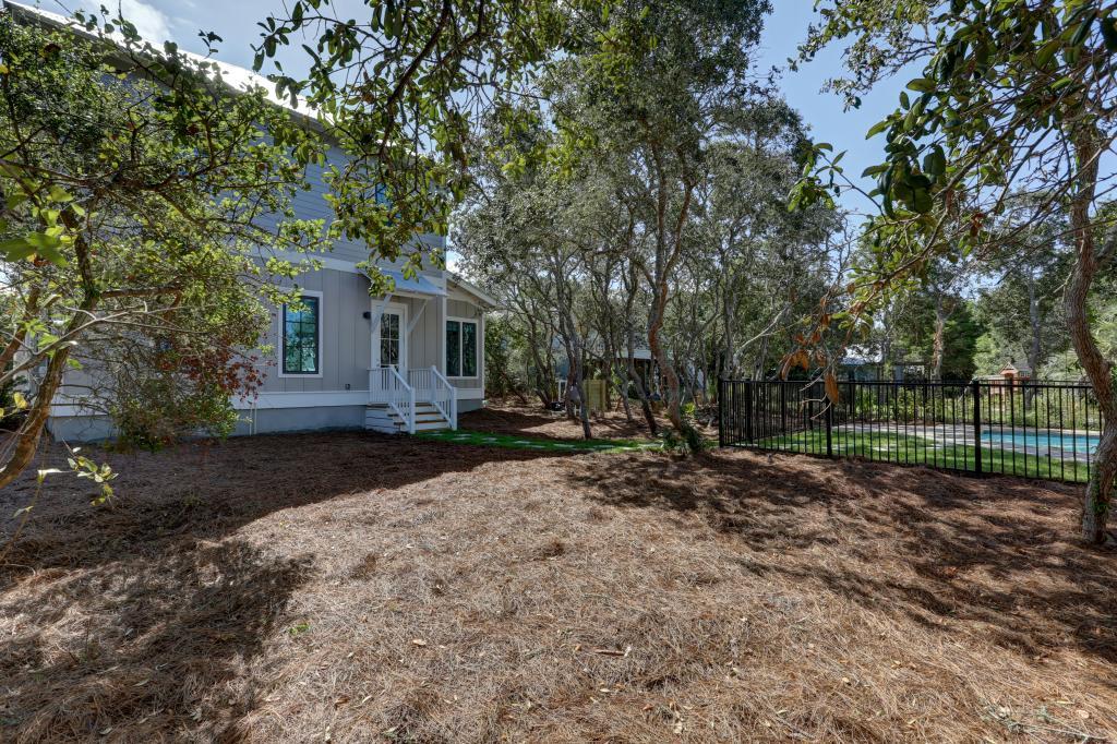 10 Sea Grade Road Santa Rosa Beach, FL 32459 - Photo 5 of 51 a view of a house with a yard and tree