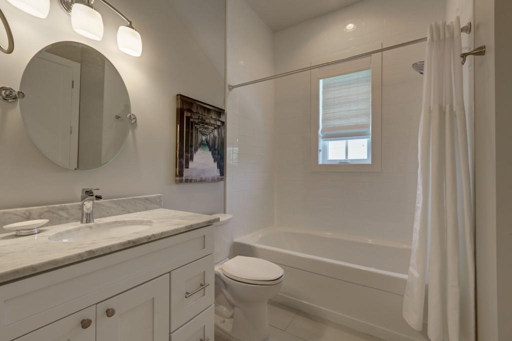 10 Sea Grade Road Santa Rosa Beach, FL 32459 - Photo 45 of 51 a bathroom with a toilet a sink and mirror