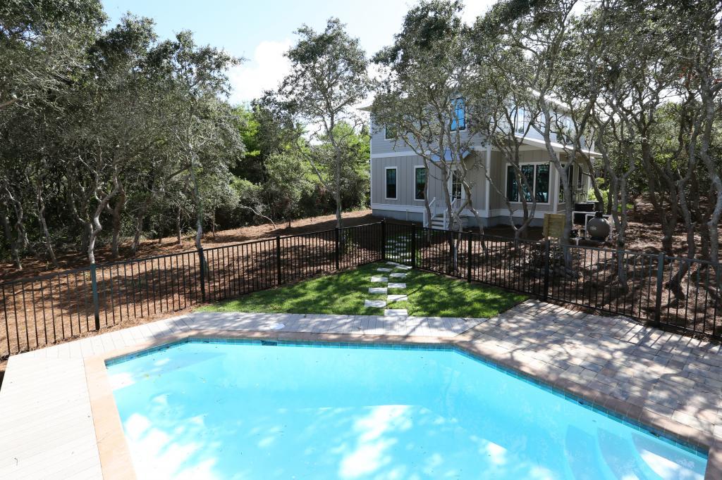 10 Sea Grade Road Santa Rosa Beach, FL 32459 - Photo 7 of 51 a front view of a house with a yard