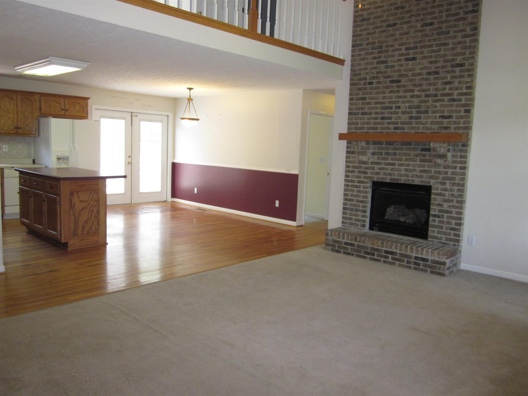 391 Faith-Rae Boulevard Morrison, TN 37357 - Photo 6 of 30 a view of an empty room with kitchen and fireplace