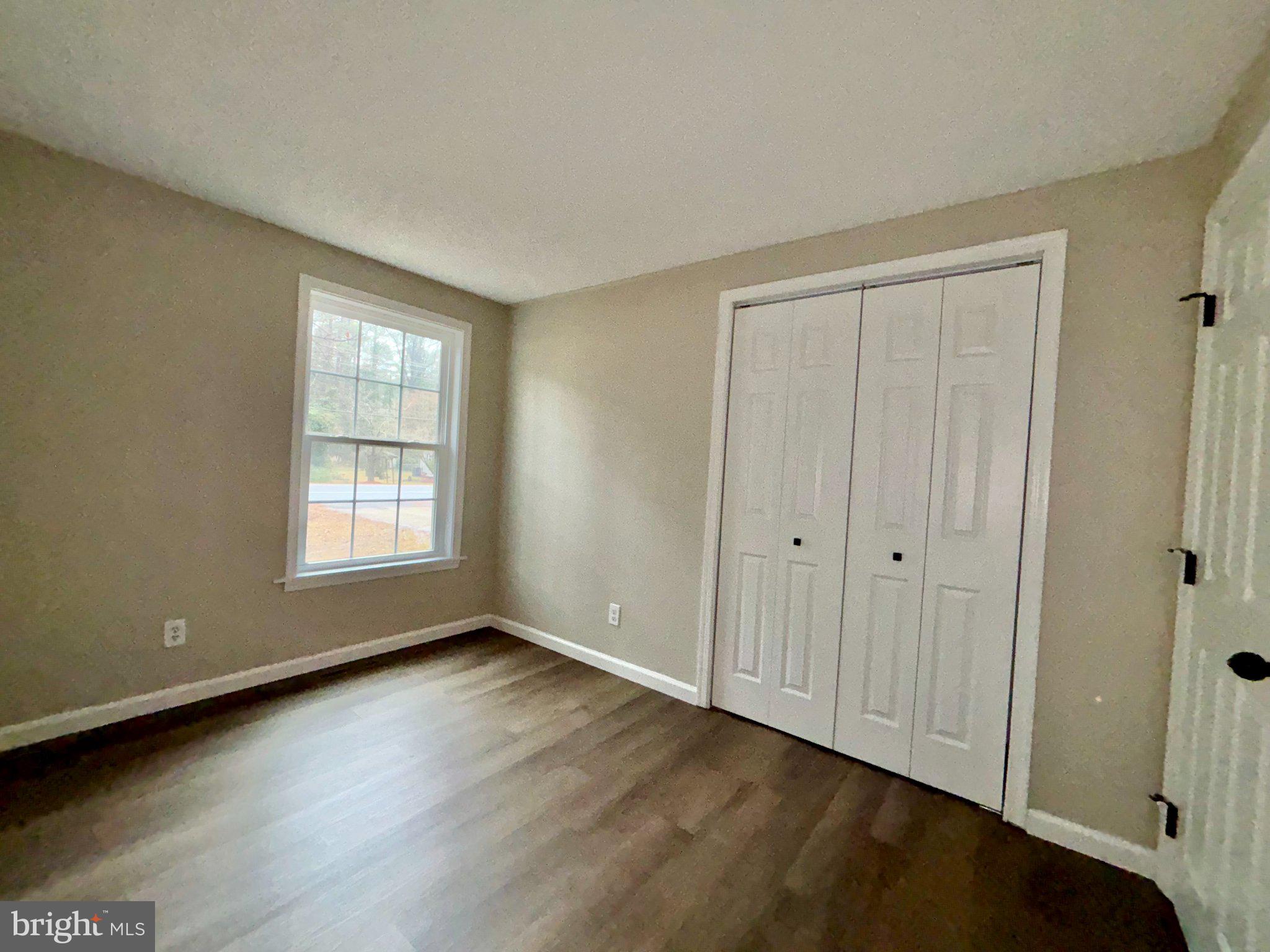 12995 Rousby Hall Road Lusby, MD 20657 - Photo 11 of 16 Bright and airy room with closet space.