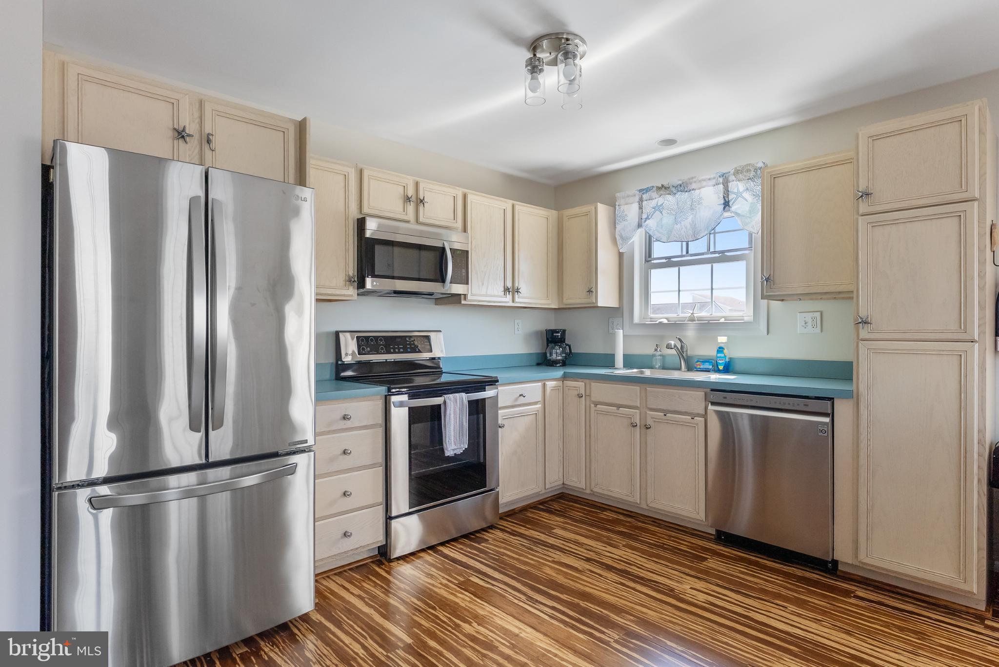 209 O Avenue Wildwood, NJ 08260 - Photo 4 of 17 a kitchen with stainless steel appliances a refrigerator sink and microwave