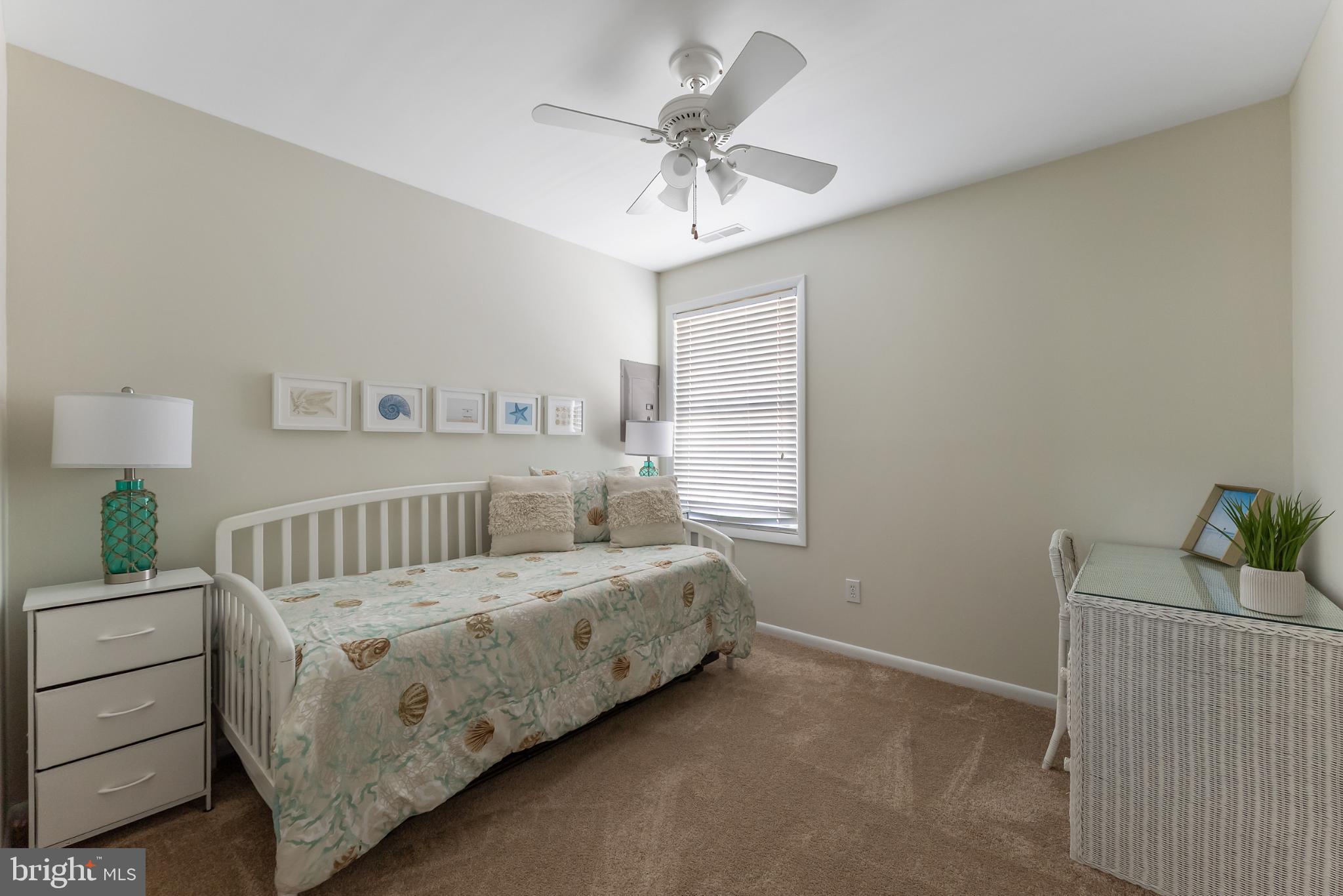 209 O Avenue Wildwood, NJ 08260 - Photo 9 of 17 a bedroom with a bed and a ceiling fan