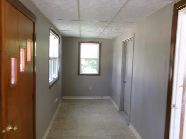 a view of a hallway with windows
