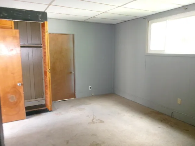 an empty room with windows