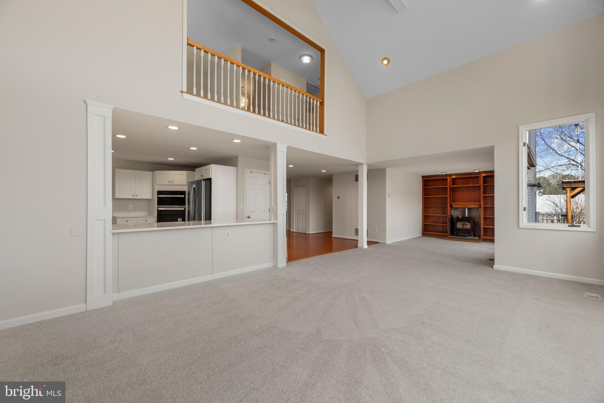 5929 Deale Beach Road Deale, MD 20751 - Photo 15 of 58 Unfurnished living room featuring light carpet, re