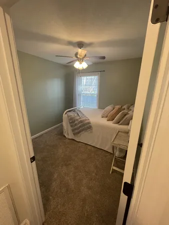 a bathroom with a sink toilet and mirror