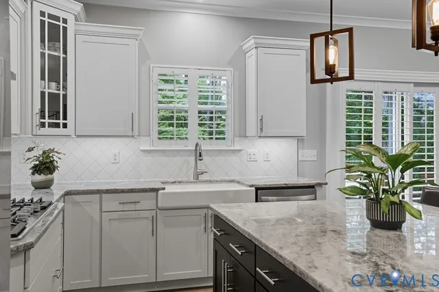 a kitchen with a sink a counter and cabinets