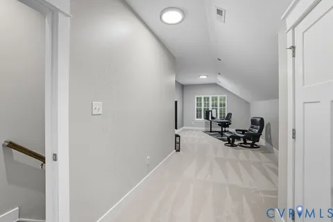 a view of a livingroom with furniture and a gate