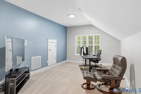 a bedroom with furniture and a window