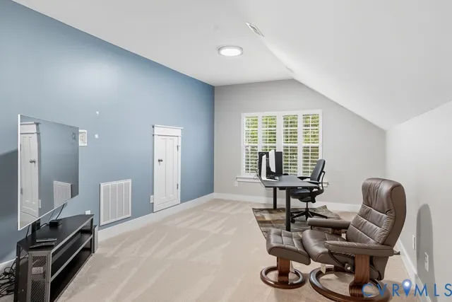 a bedroom with furniture and a window