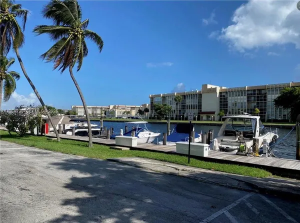 a view of a lake with a building in the background
