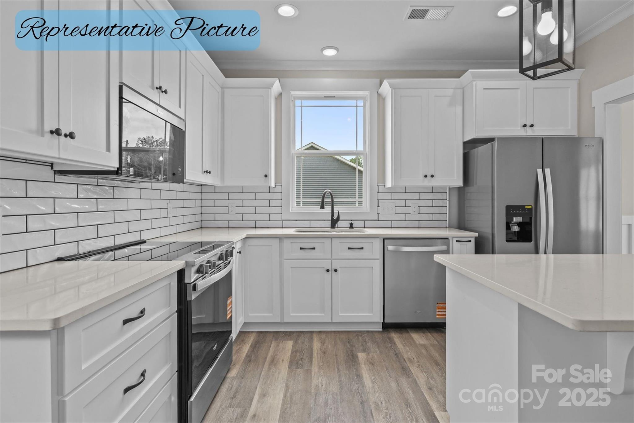 36220 Gene Road New London, NC 28127 - Photo 11 of 42 a kitchen with cabinets appliances a sink and a counter top space