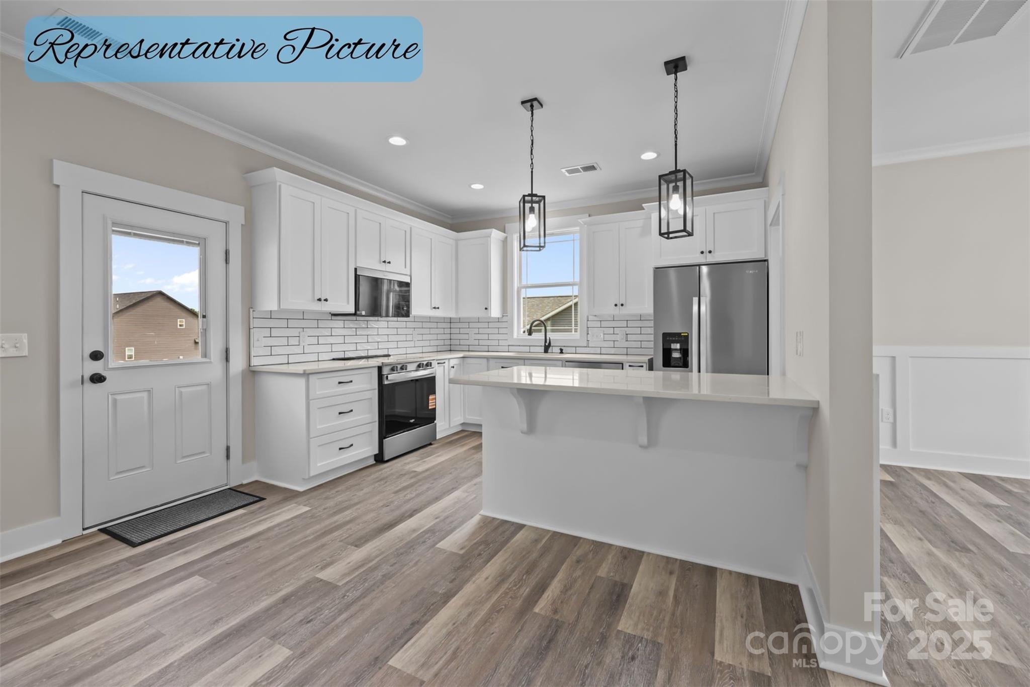 36220 Gene Road New London, NC 28127 - Photo 14 of 42 a kitchen with white cabinets and white appliances